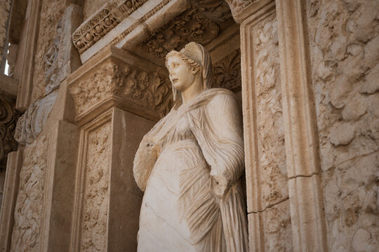 Marble draped female statue symbolizing wisdom on the ornate facade of the library of celsus in ephesus, reflecting classical roman architecture and enduring ancient heritage