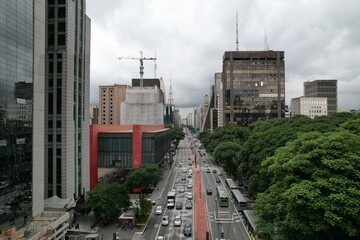Traffic flows along a busy avenue in Sao Paulo on a cloudy day