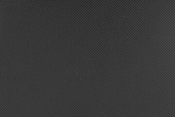 Black metal surface texture with embossed circle pattern