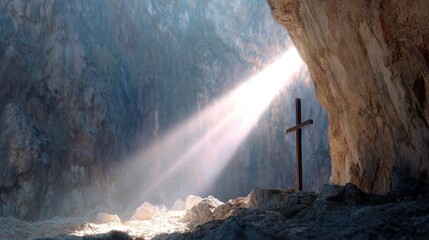 Light shines on cross in cave at early morning