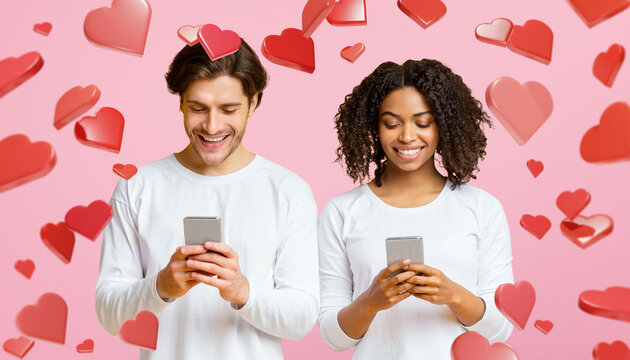 A smiling interracial couple focuses on their smartphones while ignoring each other. Hearts float around them on a yellow background, showing their gadget addiction and lack of connection.