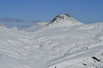The nature of the Kamchatka Peninsula combines mountainous landscapes and forested areas, and is characterized by its unique topography, flora, and fauna, as well as its climate.