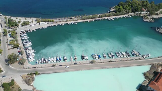 Top Down Aerial Shot of Sailboats in Turquoise Water of Methana Port