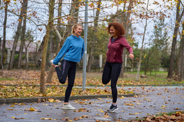Friends stretching and laughing together