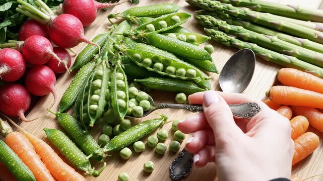 Fresh Spring Vegetables Display With Radishes Asparagus Carrots And Green Peas On Wooden Background