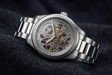 Close-up of an elegant mechanical watch on fabric