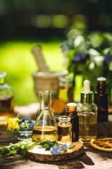 Alternative green herbal medicine. Natural plant-based ingredients for skin care beauty products, perfumery production. Small business, laboratory, drug research, organic extracts in glassware