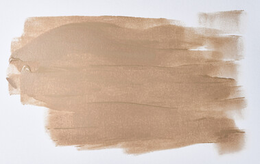 Broad brushstroke of nude or beige foundation with a distinct wave texture from the brush