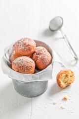 Yummy and hot mini doughnuts with caster sugar.