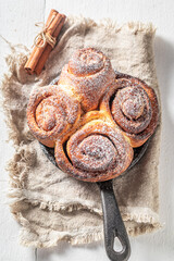 Sweet cinnamon buns as christmas dessert. Christmas snack.