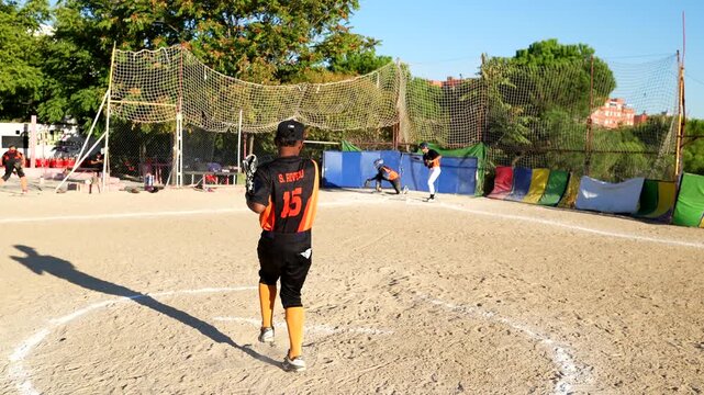 Young baseball pitcher throwing a fastball to the batter