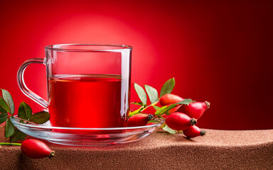 cup of rosehip tea and red background