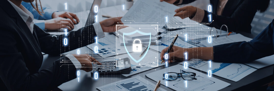 Business Meeting on Cybersecurity Strategy with Digital Protection Icons Representing Data Security and Privacy in Modern Work Environment Trope.