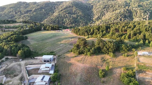 
Drone aerial shot of lush green mountains covered with dense forests, creating a peaceful and scenic natural landscape