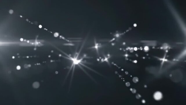 Wide video of brilliant white star-shaped light and ethereal lens flares dynamically sweeping an abstract dark grey void, emphasizing negative space. Ultra-smooth 60fps, shallow depth of field with