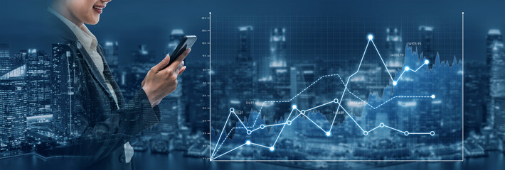 A businesswoman examines financial data on her mobile device, set against a modern city skyline. The image reflects corporate success through analytics and digital trends. Scalp