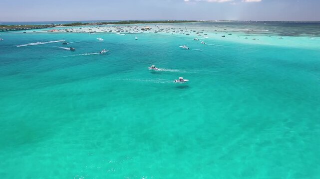 Aerial Drone View of Boats Cruising Through Turquoise Water at Crab Island, Destin, Florida	
