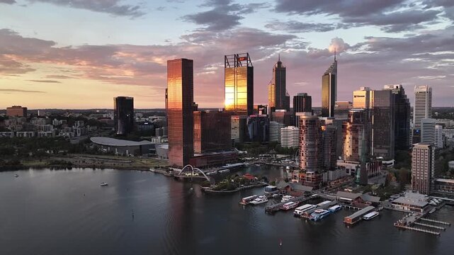Sunset over Perth City CBD, Western Australia &ndash; 4K aerial drone footage of skyline, modern skyscrapers, urban cityscape and evening light