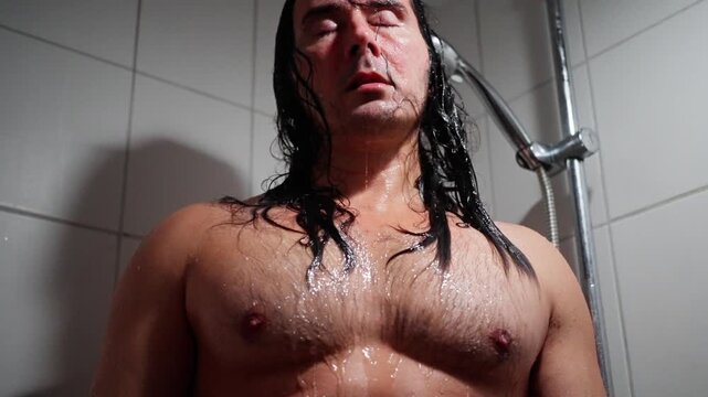 Musician In Rain, Thoughtful Artist Drenched In Water Pauses Amidst Steam And Tiled Background, Raindrenched Musician With Long Damp Hair Considers Art Amid Soft Steam And Tiled Setting