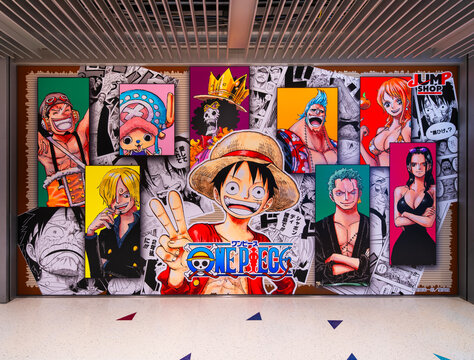 osaka, kakudach&ocirc; - dec 5 2025: Japanese Jump Shop wall display features One Piece characters like Luffy over manga panels, blending retail branding and anime culture in a vibrant indoor setting.