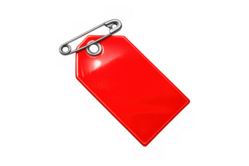 Red blank price tag or label for discount and sale information, attached with a shiny silver safety pin to clothing