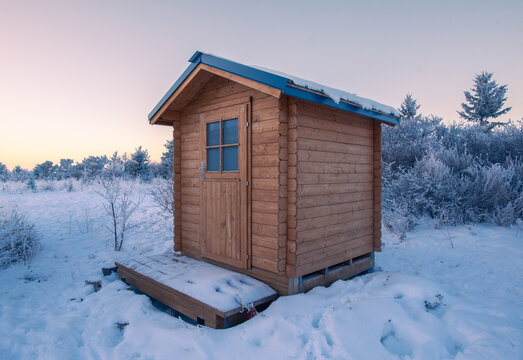 Wooden shed in the winter