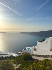 Fototapeta premium Santorini sunset over caldera with whitewashed villas and sea