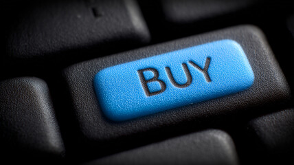 A close up of a computer keyboard key labeled buy to represent online shopping digital commerce and instant purchasing decisions.
