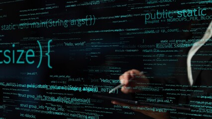 A close-up view of a programmer hands working on a tablet, surrounded by colorful code on a dark screen, capturing the essence of modern software development. Xenic