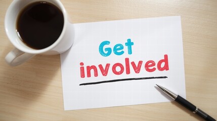 Call to action message 'Get Involved' on paper with coffee cup and pen on desk