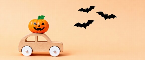 Joyful Halloween journey little pumpkin rides wooden car with silhouette bats flying