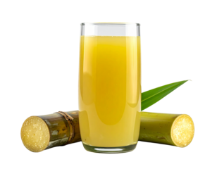 Fresh sugarcane juice in a glass with sugarcane stalks and leaves