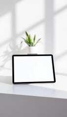 Sleek modern tablet computer with a blank screen on a clean, minimalist surface,  modern,  electronics