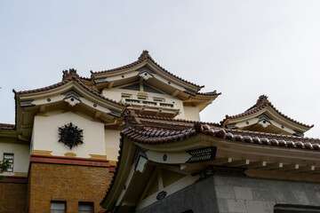 Stunning architecture of a traditional Japanese castle under clear blue skies