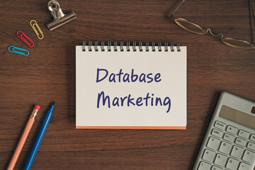 There is notebook with the word Database Marketing. It is as an eye-catching image.
