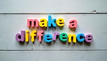 Colorful wooden letters spell Make a Difference on light wood background. Positive message of impact and social responsibility is shown in this inspirational photo concept