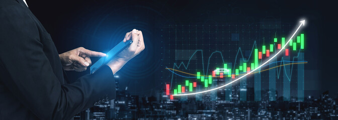 A businessperson examines financial data on a tablet, surrounded by stock market graphs and a city skyline at night, symbolizing modern finance. Impute