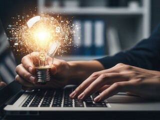 Close-up of hands typing holding glowing light bulb representing artificial intelligence automation and machine learning strategy