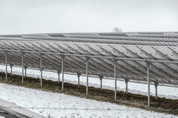 Solar panel mounting system under snow.Detailed view of solar panel mounting structures under snow. Engineering solutions for renewable energy production in cold weather