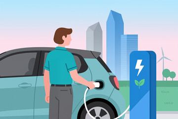 Man in teal shirt plugs white charger into light blue electric car next to blue charging station with green leaf and lightning bolt symbol in city background.