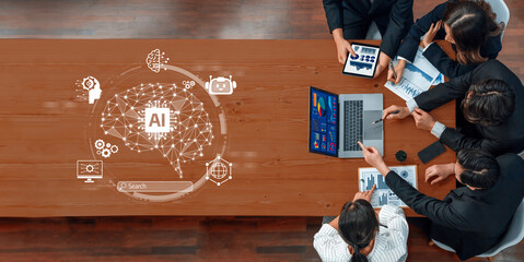 A diverse team collaborates in a modern workspace, utilizing technology to explore artificial intelligence solutions through data analysis and insightful discussion. Trope