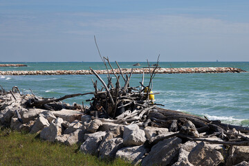 Wooden huts at the Murazzi beach on Pellestrina lagoon