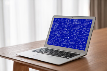 Mathematic equations and modish formula on computer screen showing concept of science and education