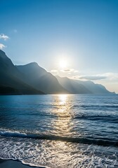 Brilliant sun casts a golden reflection across the water near coastal mountains during twilight