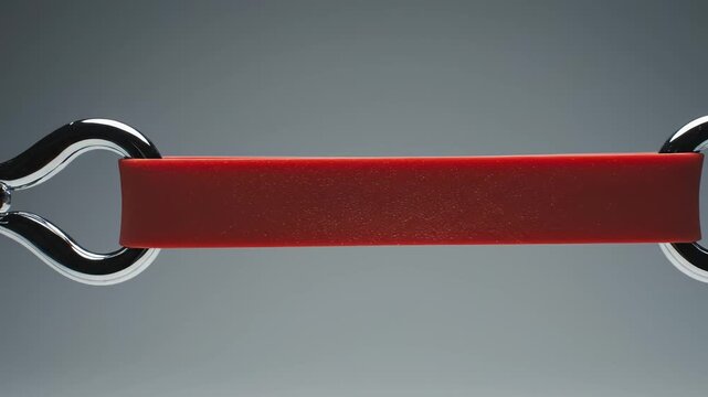 Red rubber band with metal hooks