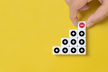 Plus and minus icons on dice. Separate the negative from positive, removing the weaknesses or negativity, positive thinking, negative feedback or subtraction