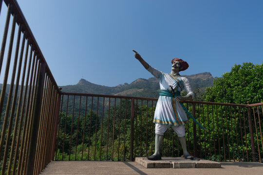 Statue of a Maratha warrior at Pratapgad near Mahabaleshwar village, capturing culture and history of the fierce fighter in traditional attire, celebrating heritage and valor in scenic historic fort.