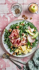 Arugula Prosciutto Salad with Apple Cheese Walnuts Rustic Plate Pink Tile Background