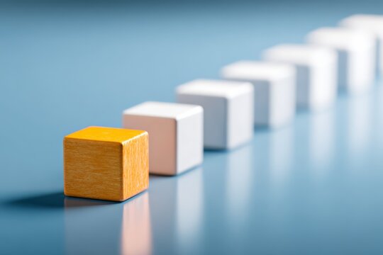 Single colored block standing out among neutral blocks, symbolizing differentiation, focus, prioritization, and strategic emphasis.