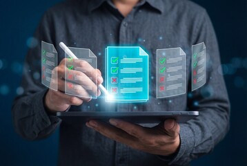 Businessman using digital tablet and stylus to approve virtual checklist documents with green ticks